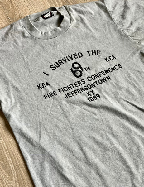 Medium - Vintage 80s I Survived 69th Fire Fighter Confernce T-Shirt